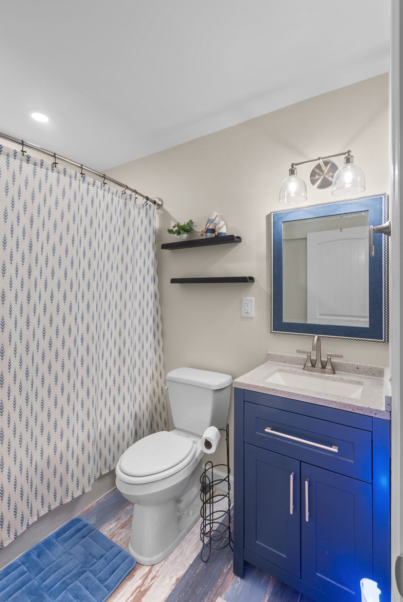 415 South Ingram Street Pulaski, TN 38478 - Photo 16 of 33 a bathroom with a toilet a sink and mirror
