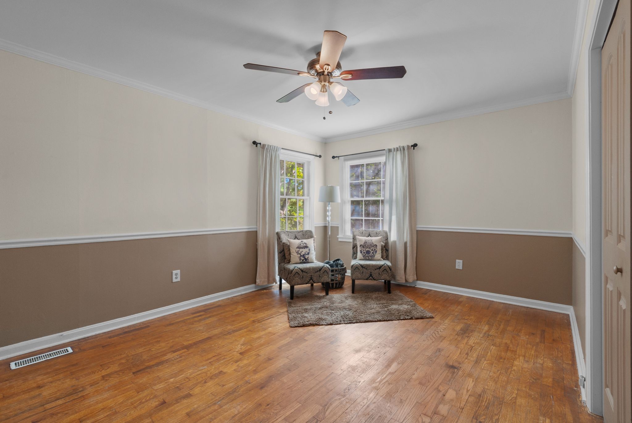 415 South Ingram Street Pulaski, TN 38478 - Photo 18 of 33 an empty room with wooden floor and windows