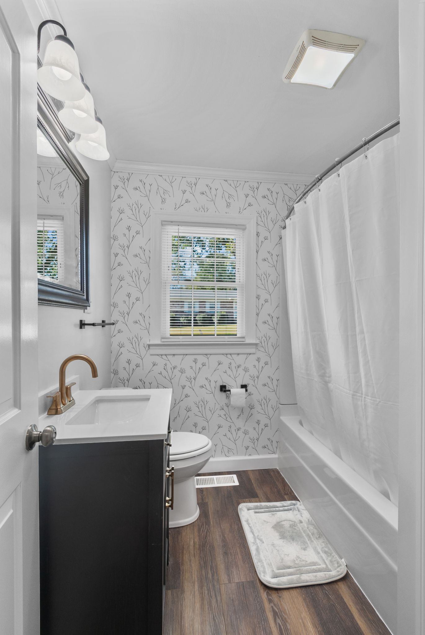 415 South Ingram Street Pulaski, TN 38478 - Photo 23 of 33 a bathroom with a sink and a mirror