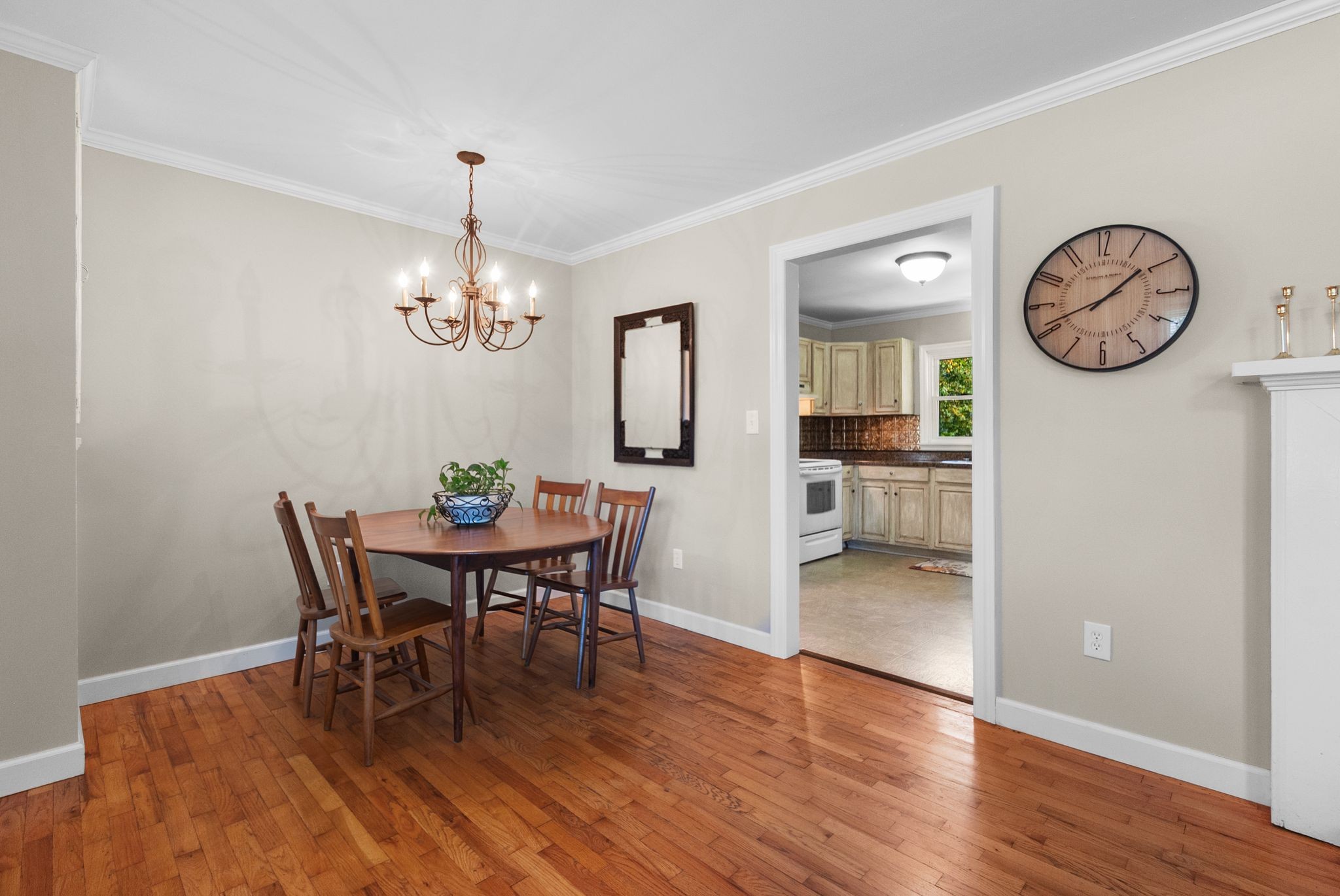 415 South Ingram Street Pulaski, TN 38478 - Photo 10 of 33 a view of a dining room with furniture a chandelier and wooden floor