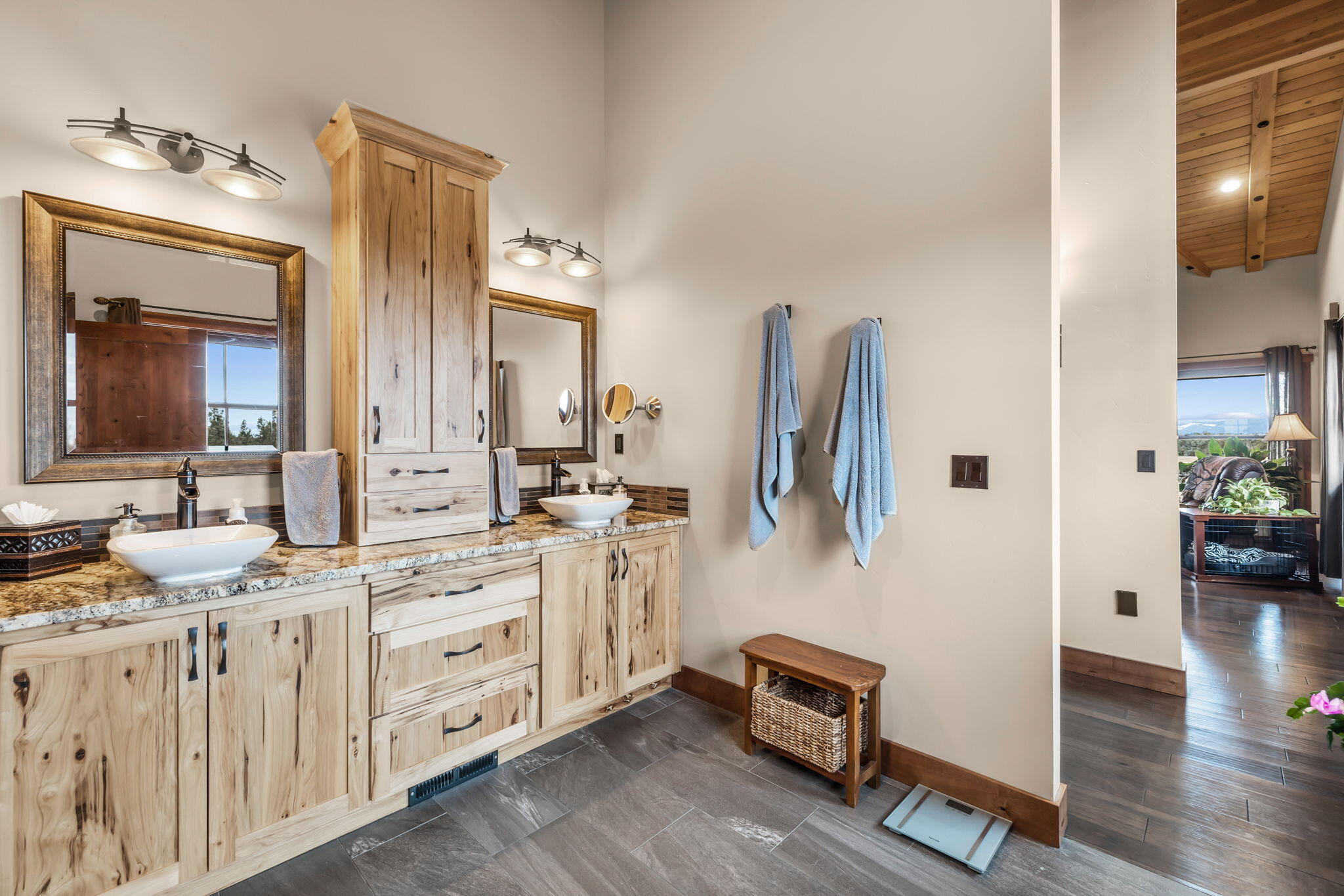 23150 Rickard Road Bend, OR 97702 - Photo 24 of 60 a spacious bathroom with a double vanity sink and a mirror