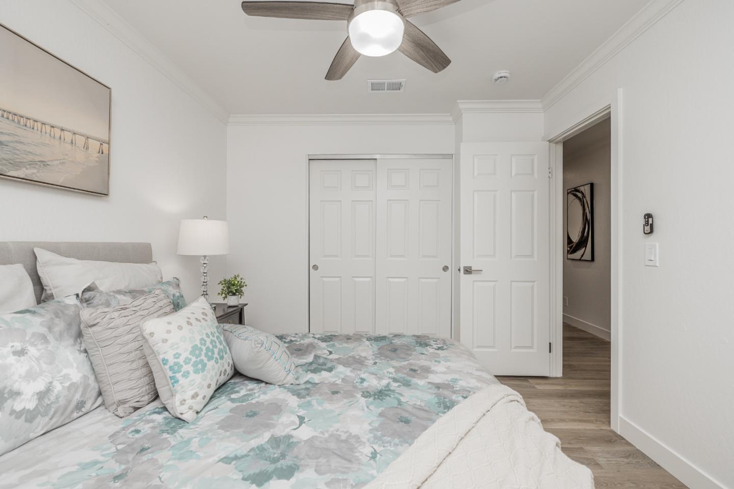 756 Acorn Court San Ramon, CA 94583 - Photo 15 of 33 a bedroom with a large bed and a chandelier