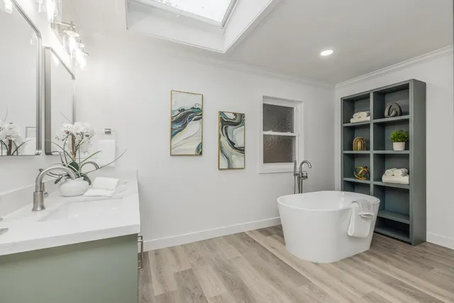 a view of a bathroom with a sink and mirror