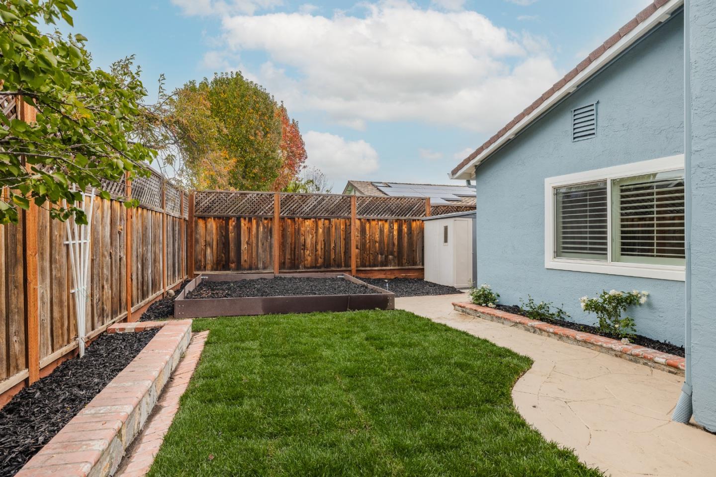 756 Acorn Court San Ramon, CA 94583 - Photo 29 of 33 a view of a backyard with table and chairs and wooden fence