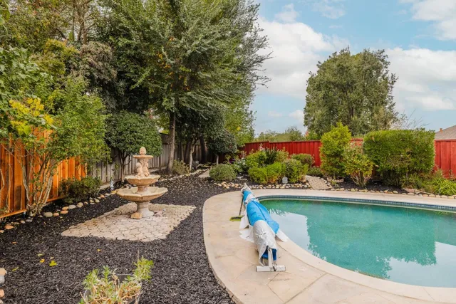 a view of a swimming pool with a patio
