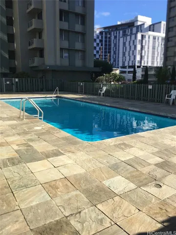 a view of a swimming pool with a chair