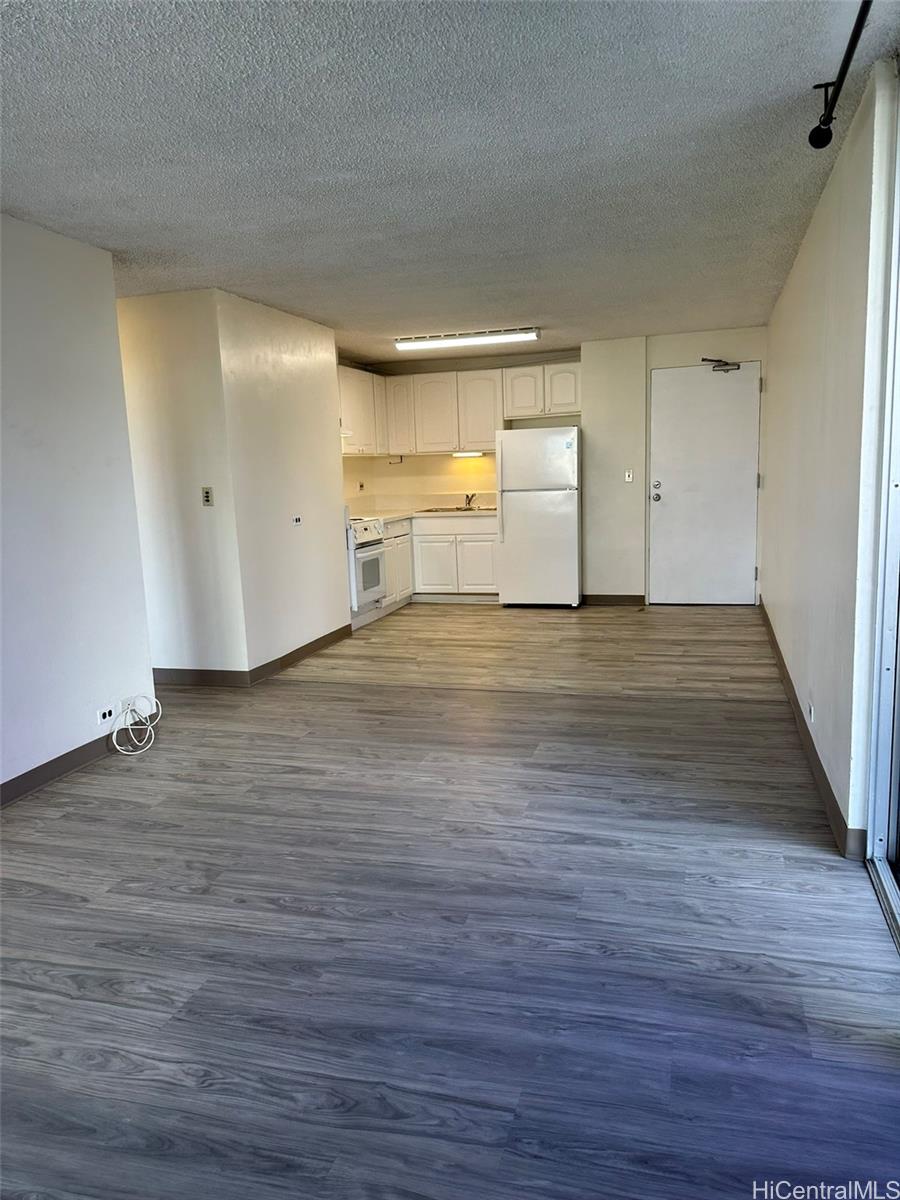 2651 Kuilei Street, Unit B21 Honolulu, HI 96826 - Photo 3 of 20 a view of a room with wooden floor