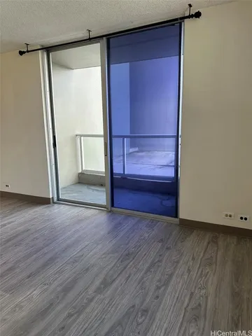 a view of front door with wooden floor