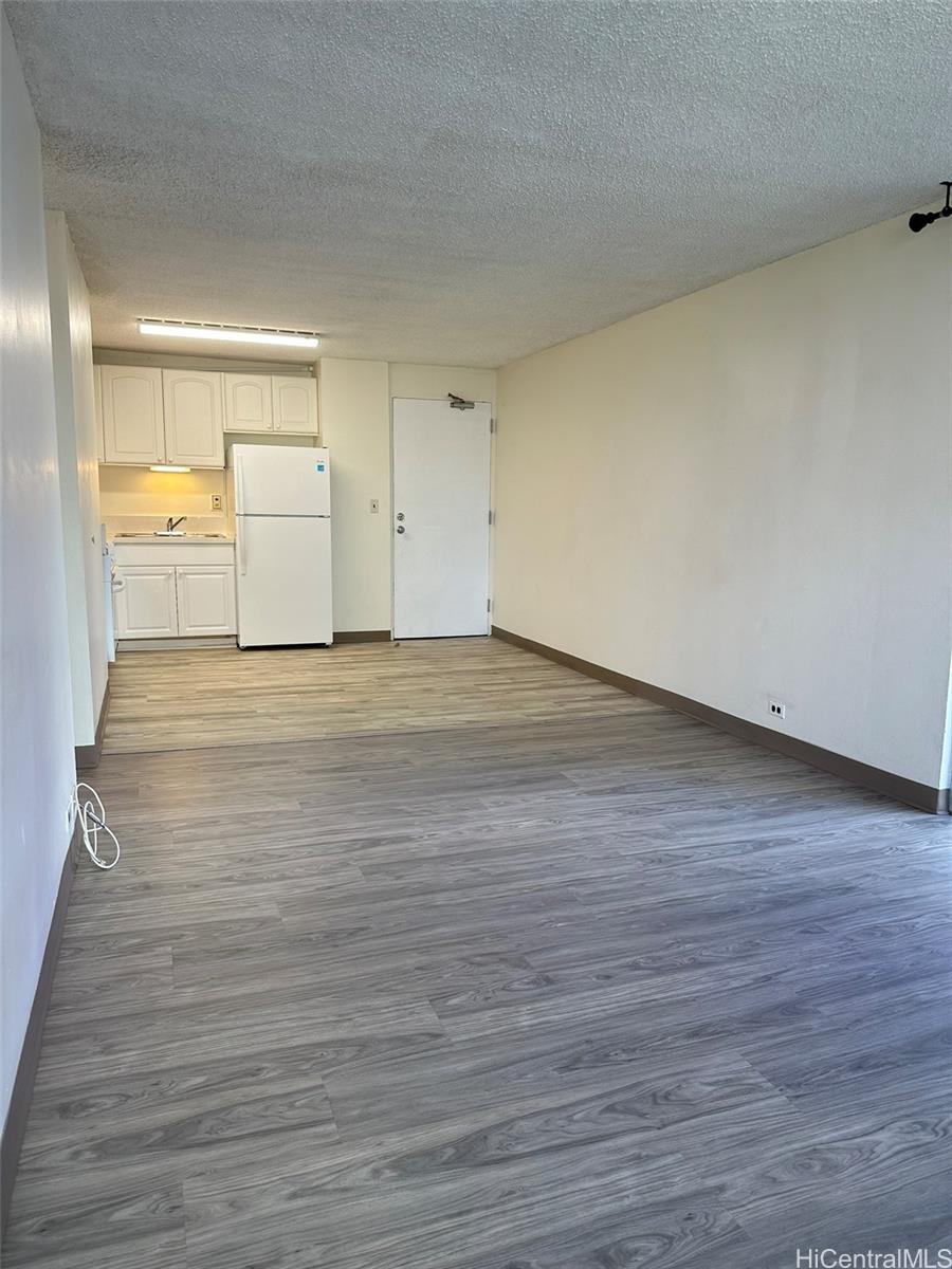 2651 Kuilei Street, Unit B21 Honolulu, HI 96826 - Photo 7 of 20 a view of a livingroom with wooden floor