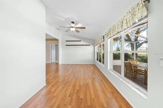 a view of kitchen with windows and ceiling fan