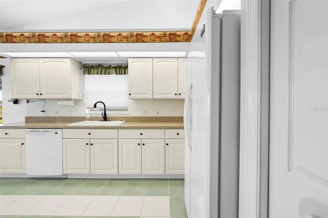 an aerial view of a house with a swimming pool yard and outdoor seating