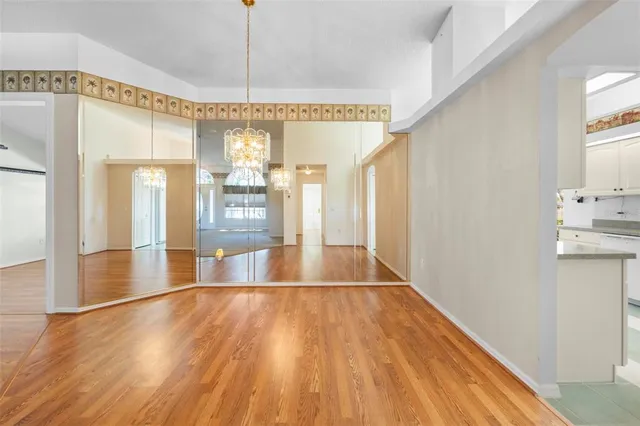 a view of a yard with plants and trees