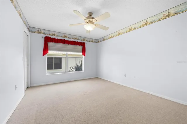 an aerial view of a houses with swimming pool