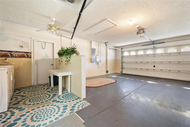 a view of a house with a large trees