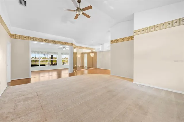 a view of an empty room with a window