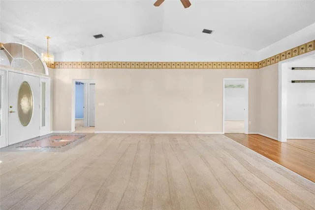 a view of a livingroom with wooden floor and cabinet