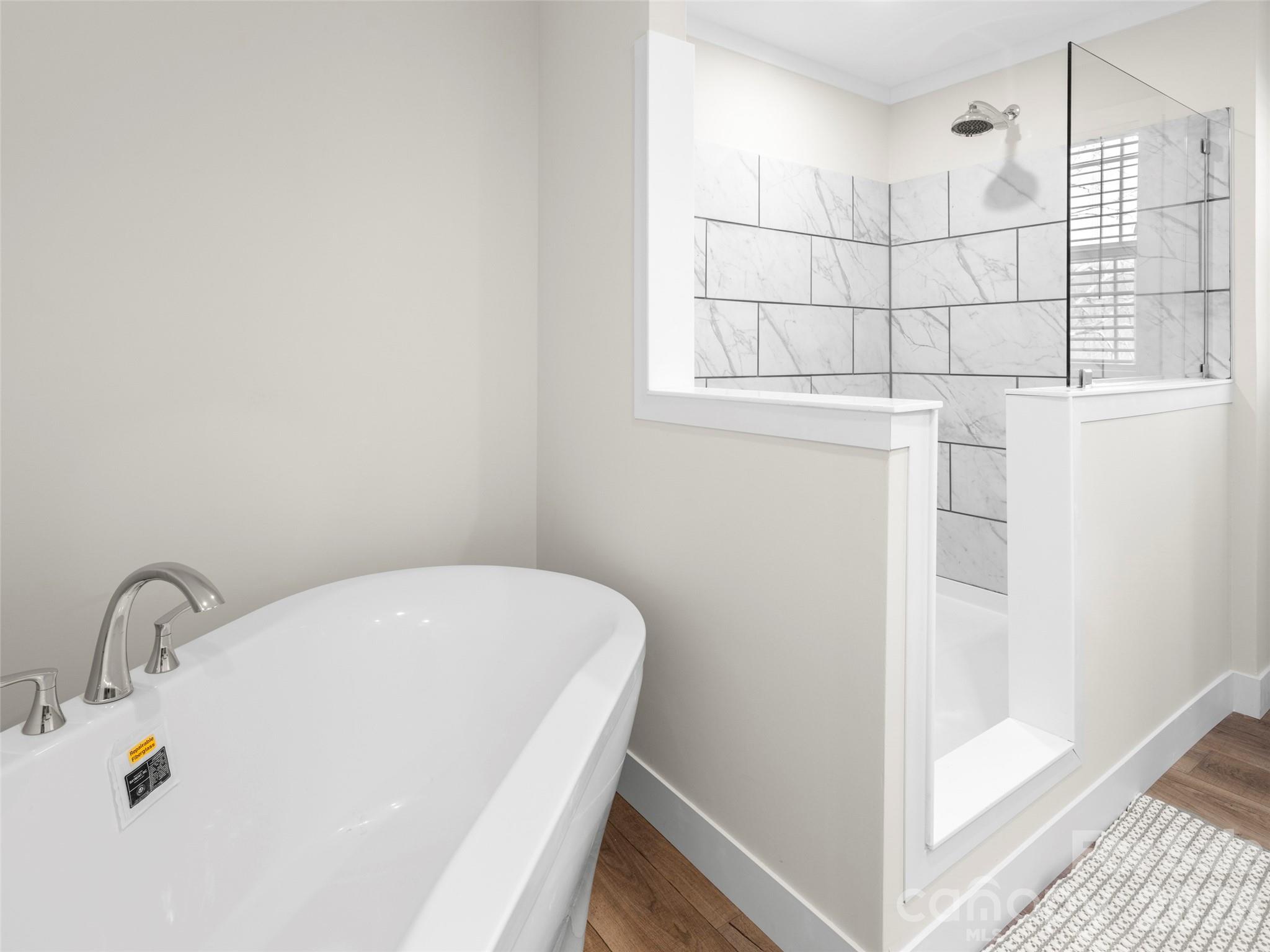 512 Hutch Mountain Road Fletcher, NC 28732 - Photo 16 of 23 a bathroom with a bathtub