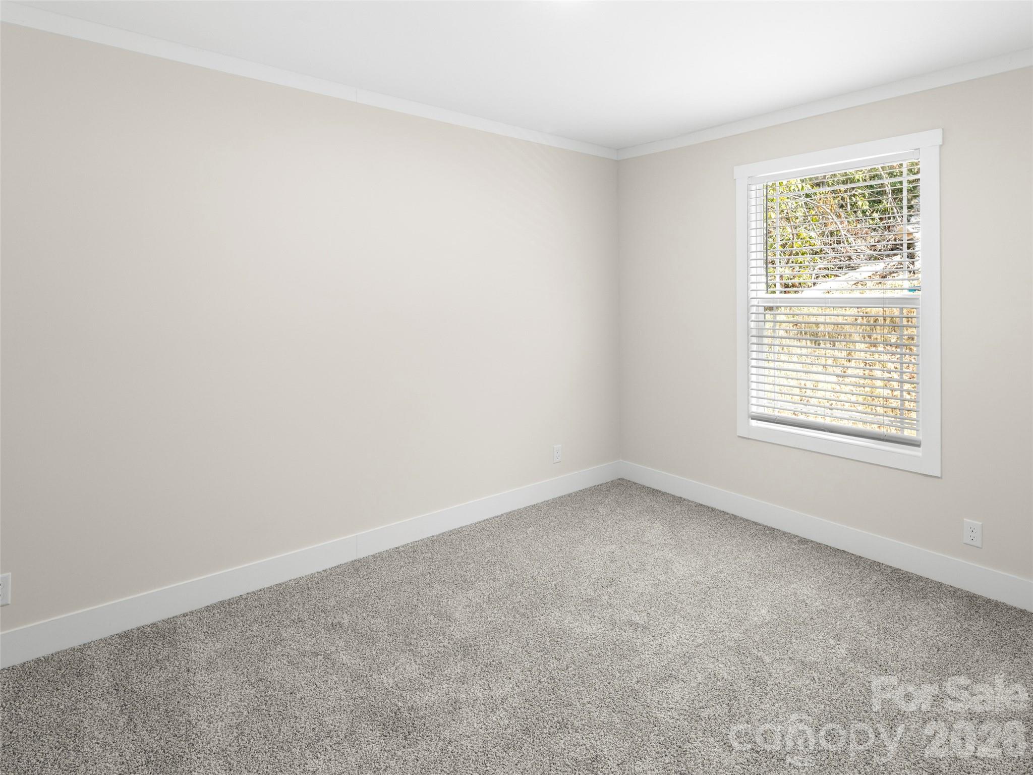 512 Hutch Mountain Road Fletcher, NC 28732 - Photo 18 of 23 an empty room with a window