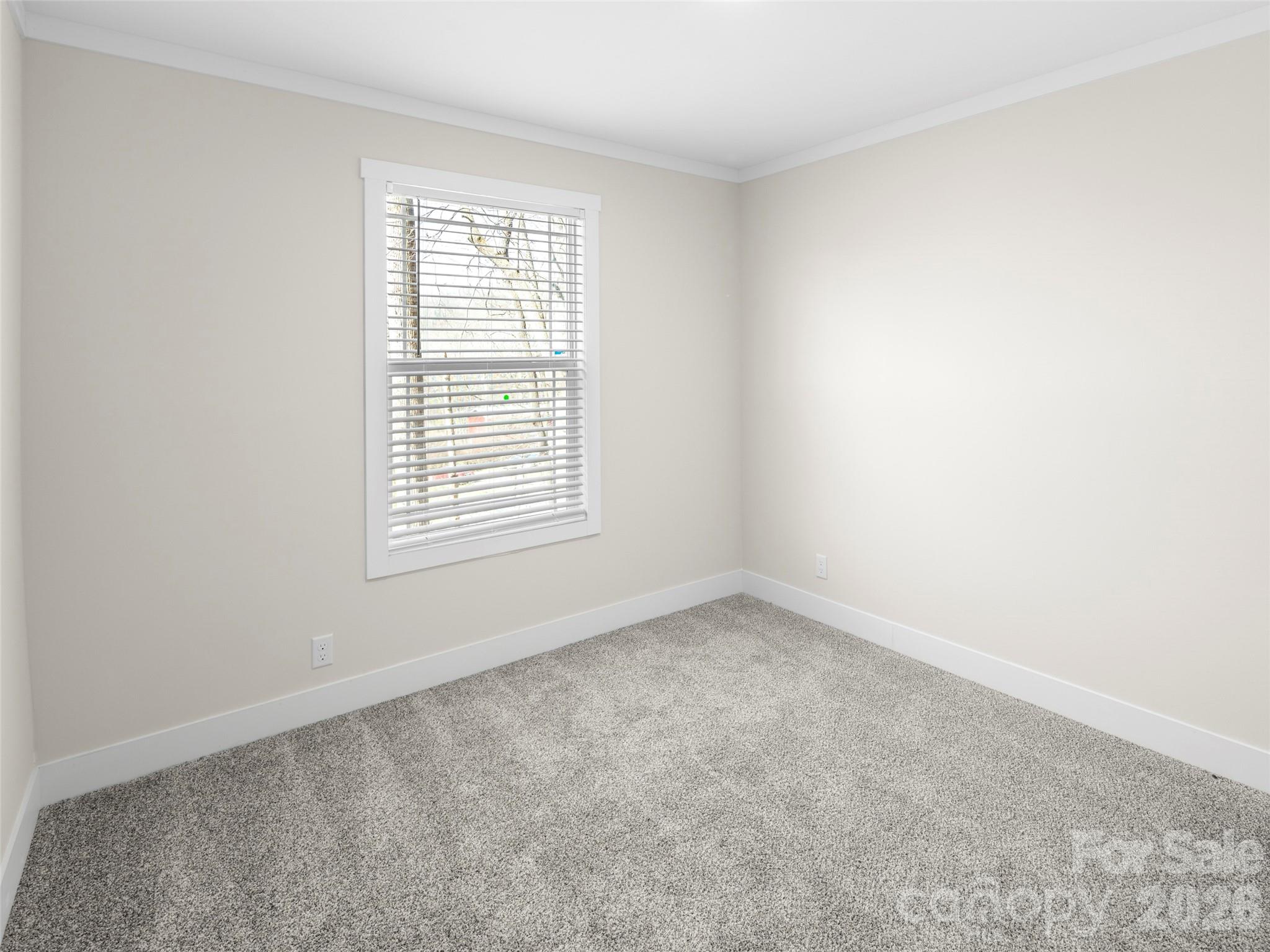 512 Hutch Mountain Road Fletcher, NC 28732 - Photo 19 of 23 an empty room with a window