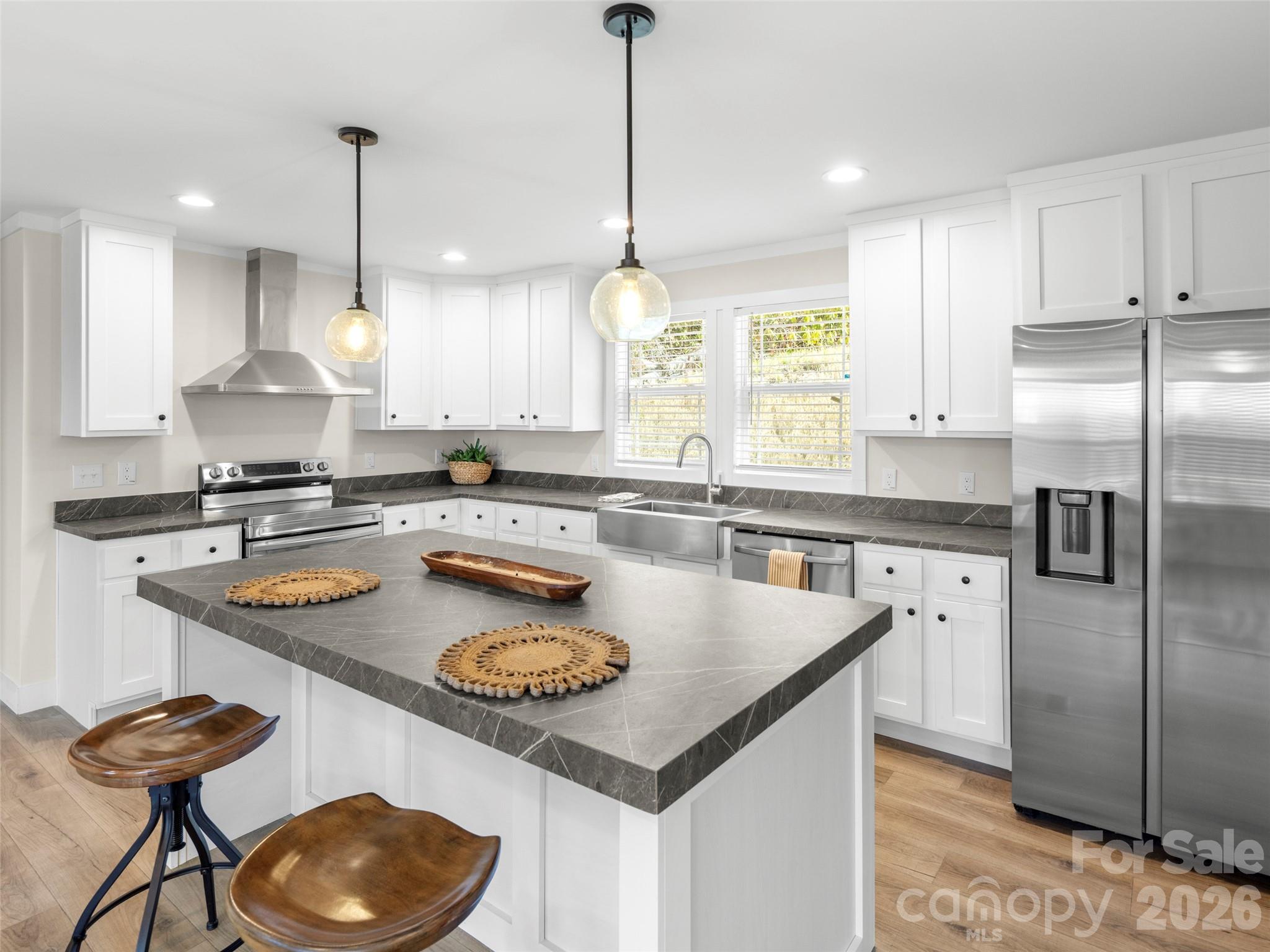 512 Hutch Mountain Road Fletcher, NC 28732 - Photo 4 of 23 a kitchen with stainless steel appliances granite countertop a sink a stove a refrigerator a center island and cabinets