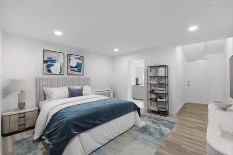 a view of an empty room and wooden floor