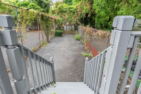 a view of balcony with furniture