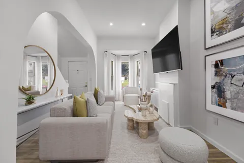 a view of a room with wooden floor and stairs