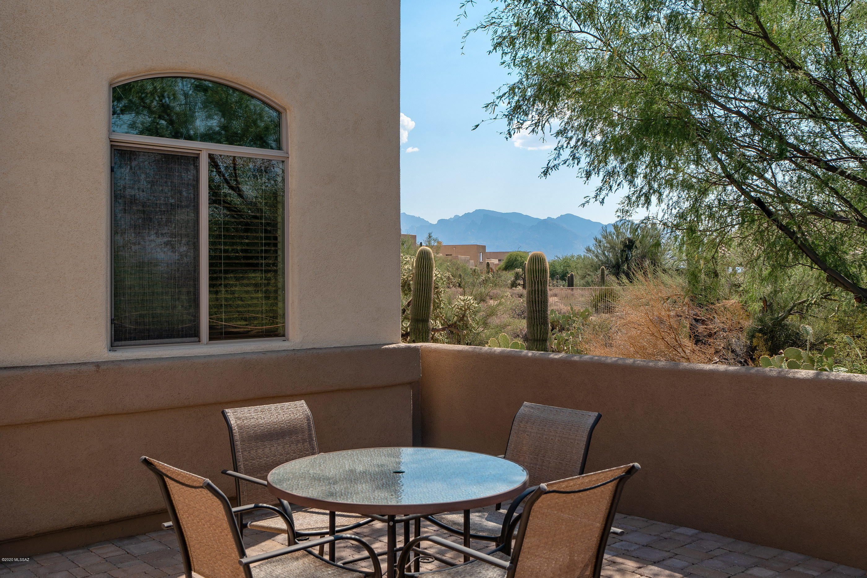 4440 West Crystal Ranch Place Marana, AZ 85658 - Photo 3 of 28 a view of a chair and table in the balcony