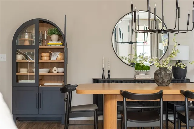 a kitchen with stainless steel appliances kitchen island granite countertop a refrigerator and microwave