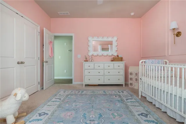 a bedroom with a bed and a closet