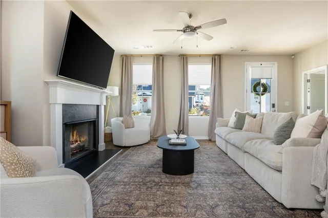 a living room with furniture and a fireplace