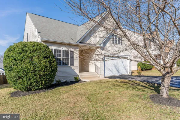 a view of a backyard of the house
