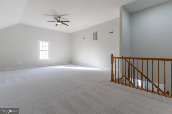 a view of a livingroom with a staircase