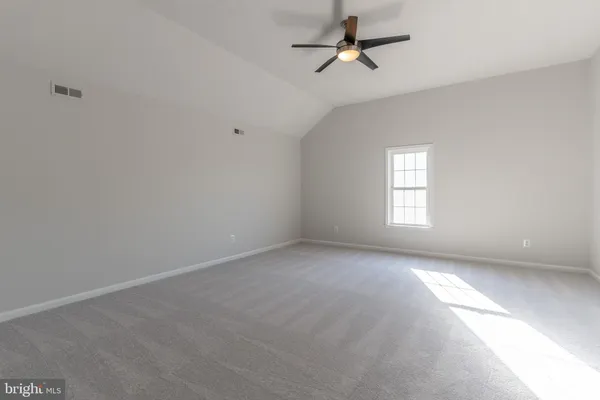 a view of empty room with windows