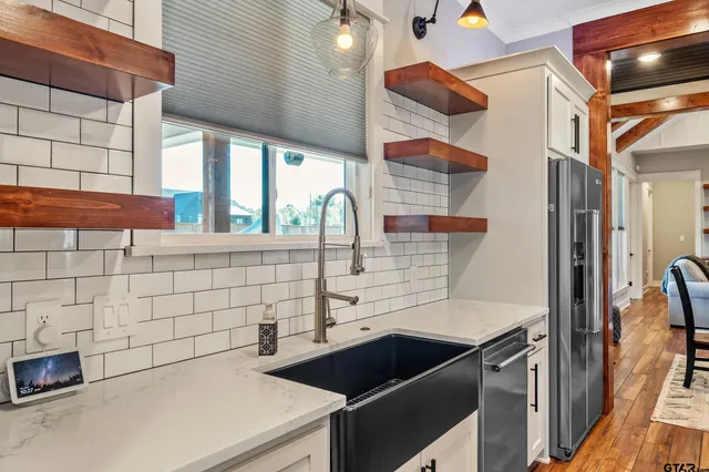 a kitchen with a sink and cabinets