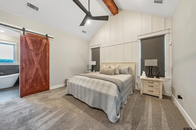 a bedroom with a large bed and a closet