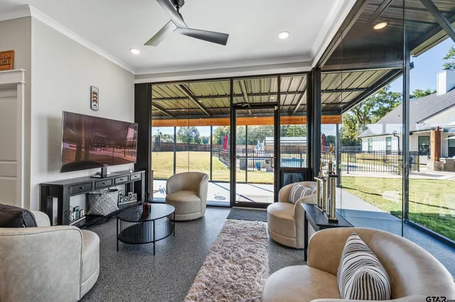 a living room with furniture and a large window