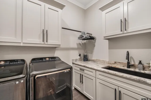a kitchen with appliances cabinets and a table