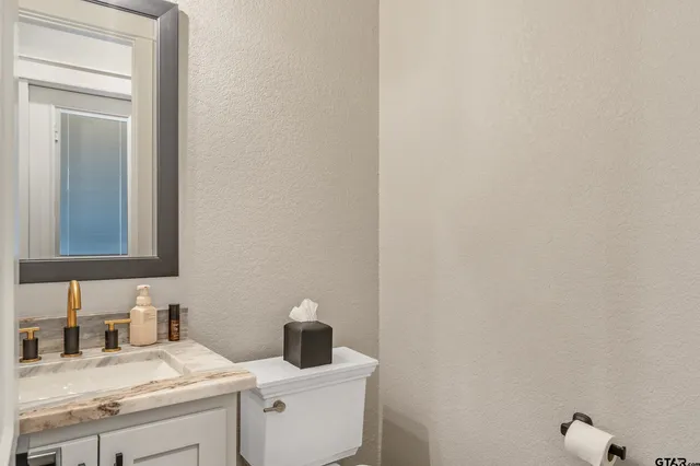 a outdoor living space with furniture and a fireplace