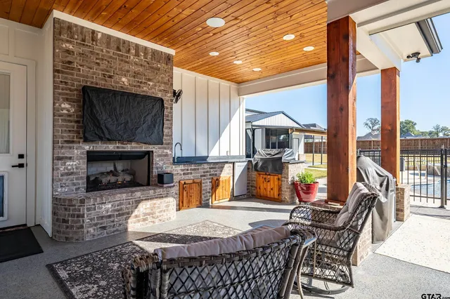 a balcony with furniture and a potted plant