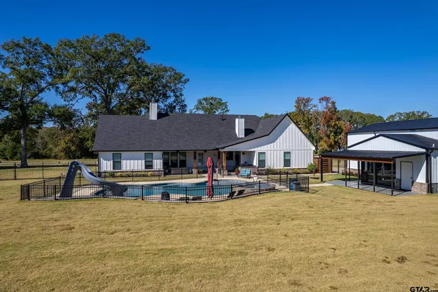 swimming pool view with a outdoor seating
