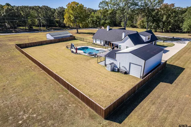 a view of backyard with garage