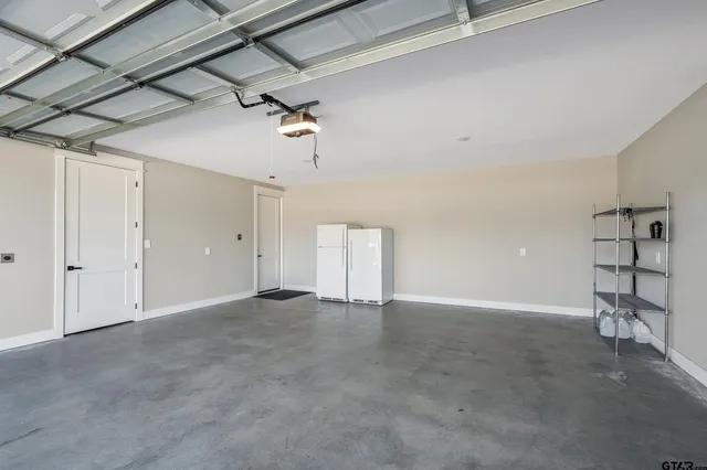 a view of a room with furniture and a garage