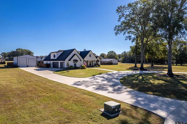 a view of a swimming pool with an outdoor seating