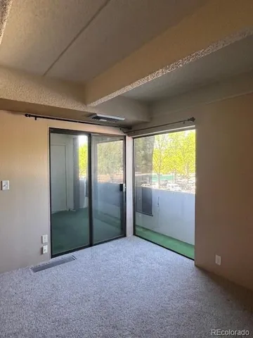 an empty room with large window