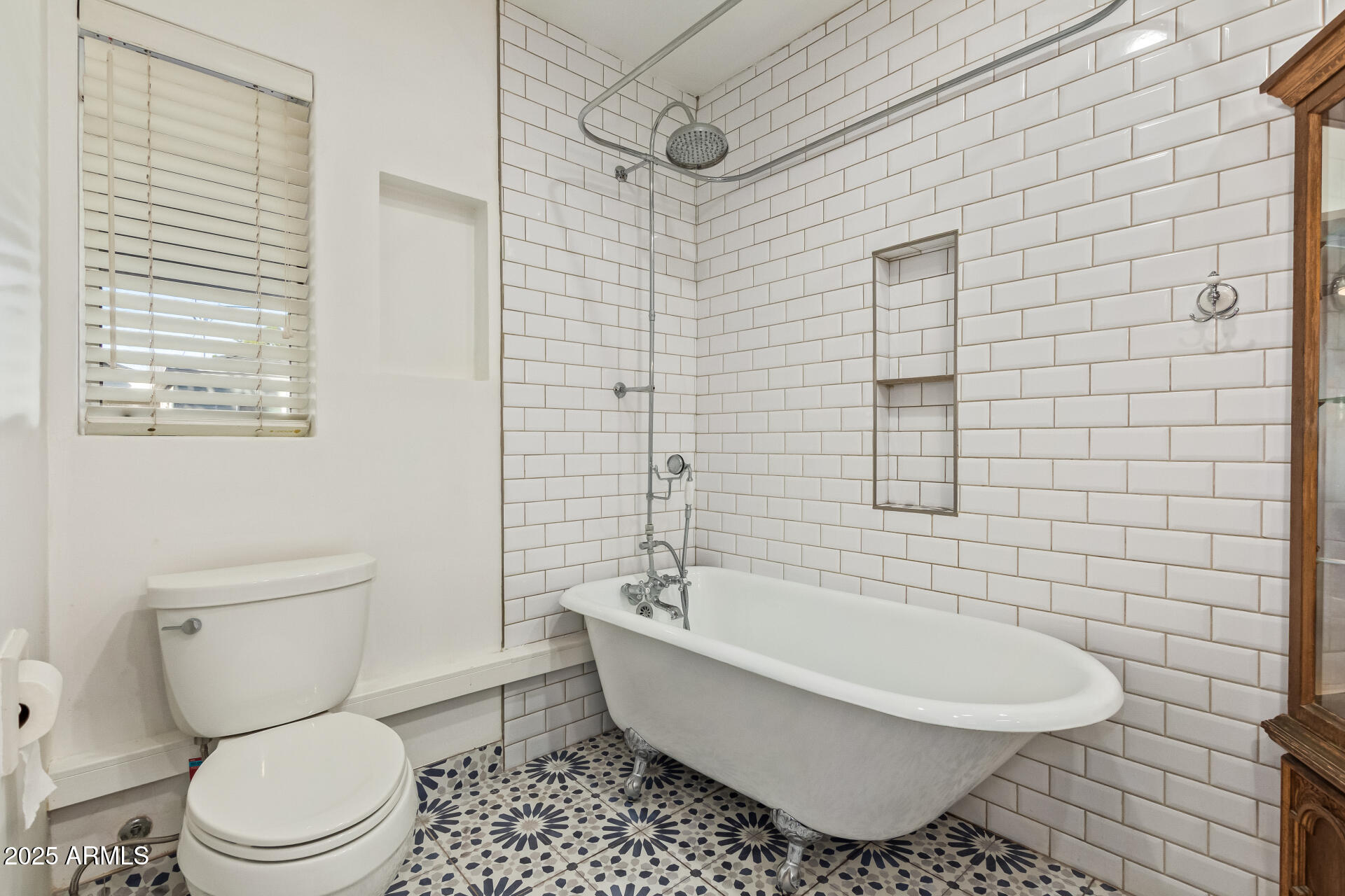 336 Virginia Avenue Phoenix, AZ 85003 - Photo 13 of 29 a bathroom with a toilet a sink a mirror and shower