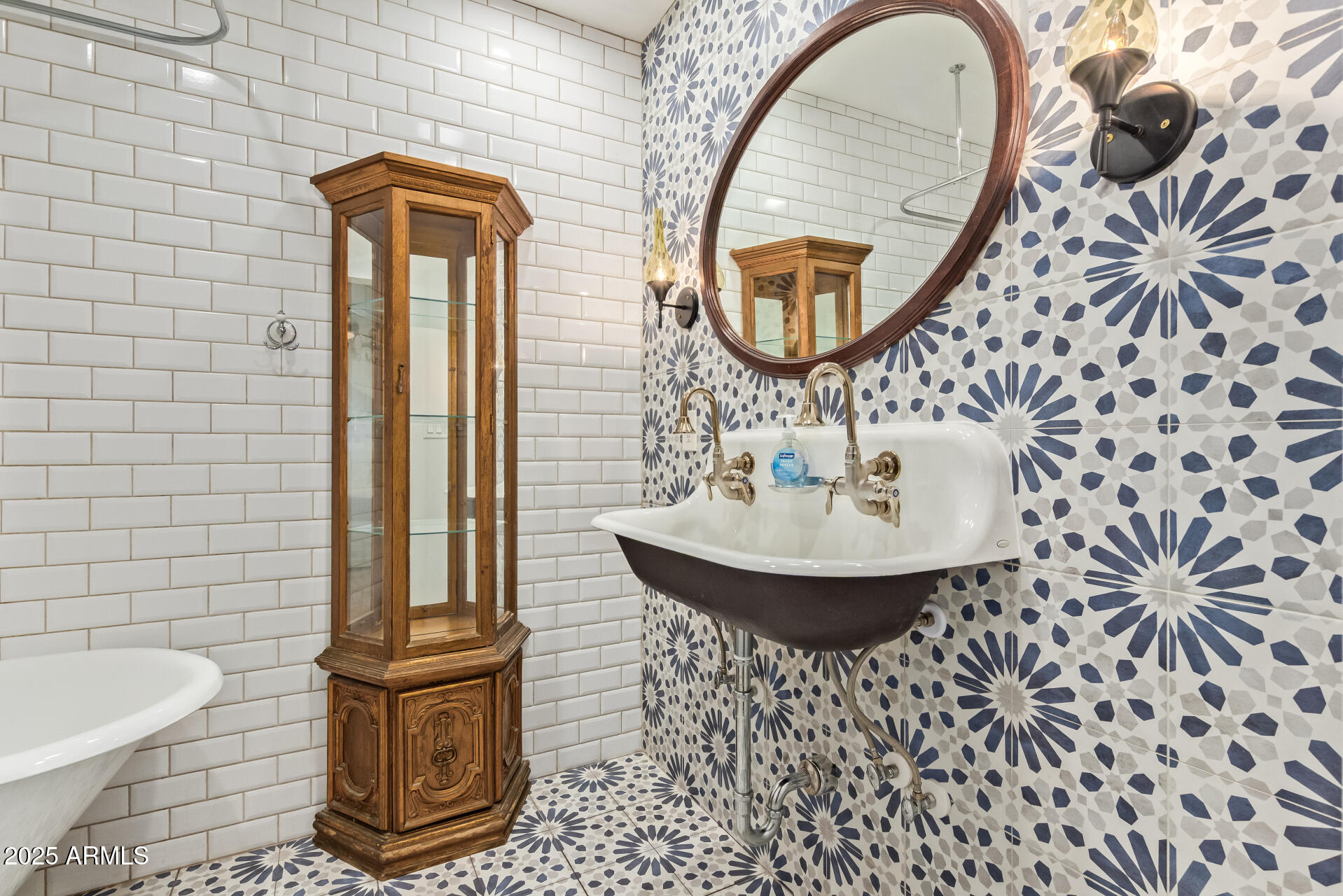336 Virginia Avenue Phoenix, AZ 85003 - Photo 14 of 29 a bathroom with a sink a mirror and a toilet