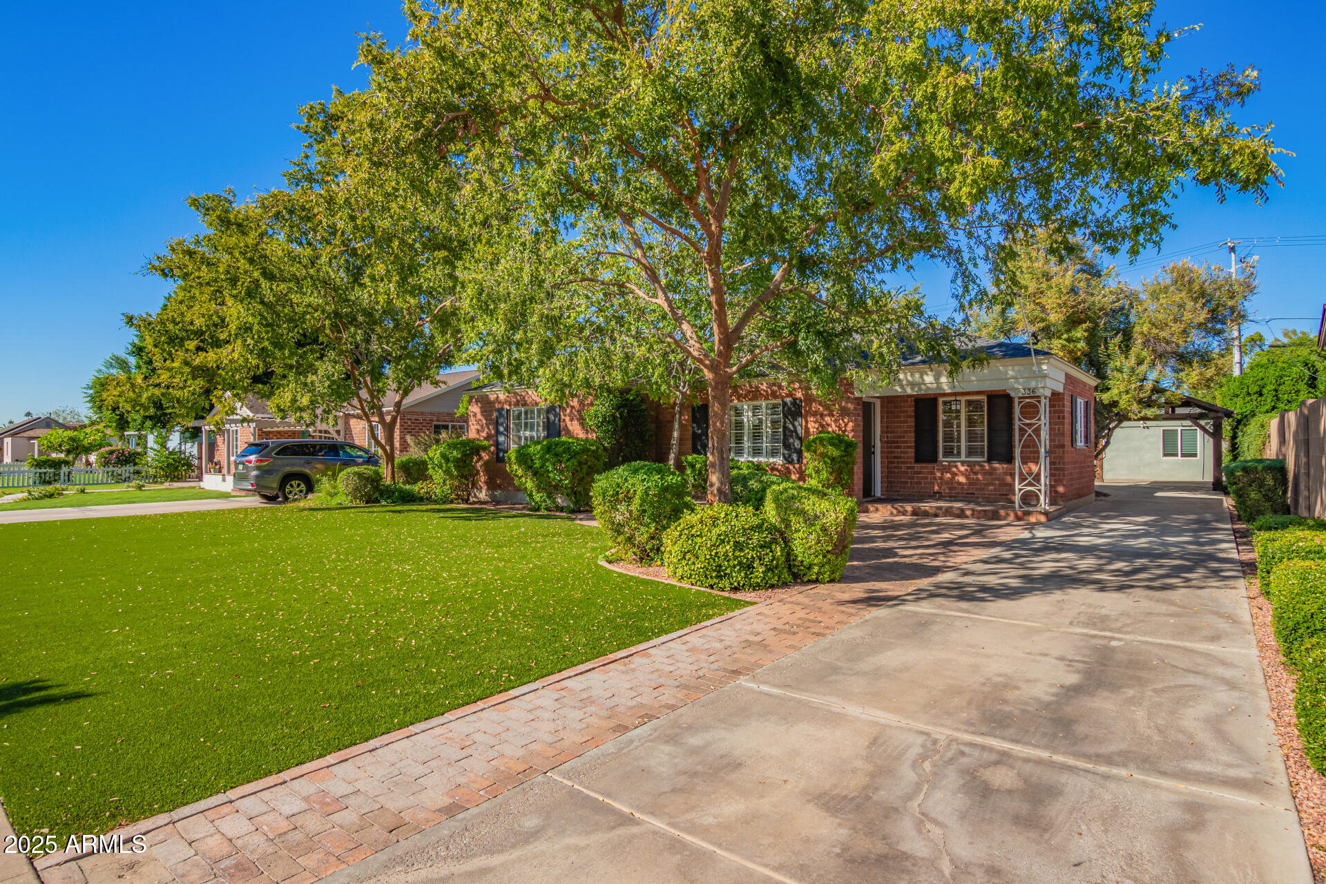 336 Virginia Avenue Phoenix, AZ 85003 - Photo 2 of 29 a front view of a house with a yard