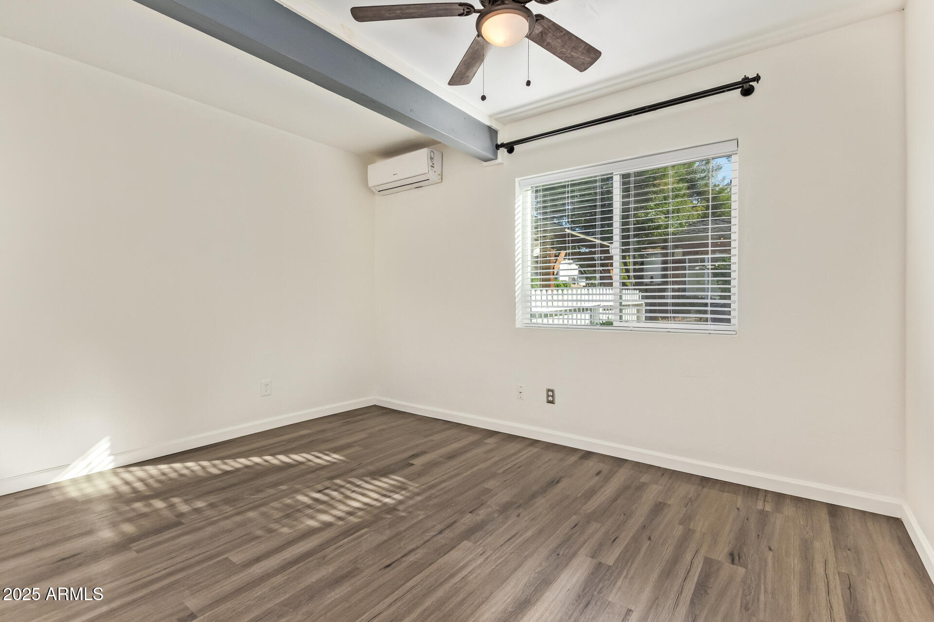336 Virginia Avenue Phoenix, AZ 85003 - Photo 22 of 29 a view of empty room with wooden floor and fan