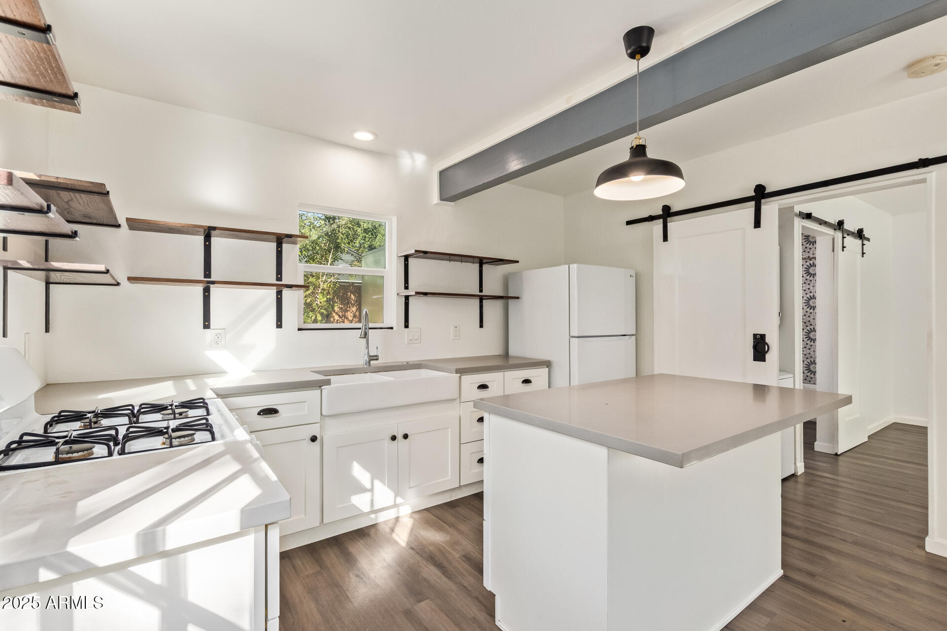 336 Virginia Avenue Phoenix, AZ 85003 - Photo 24 of 29 a kitchen with stainless steel appliances granite countertop a sink stove and refrigerator